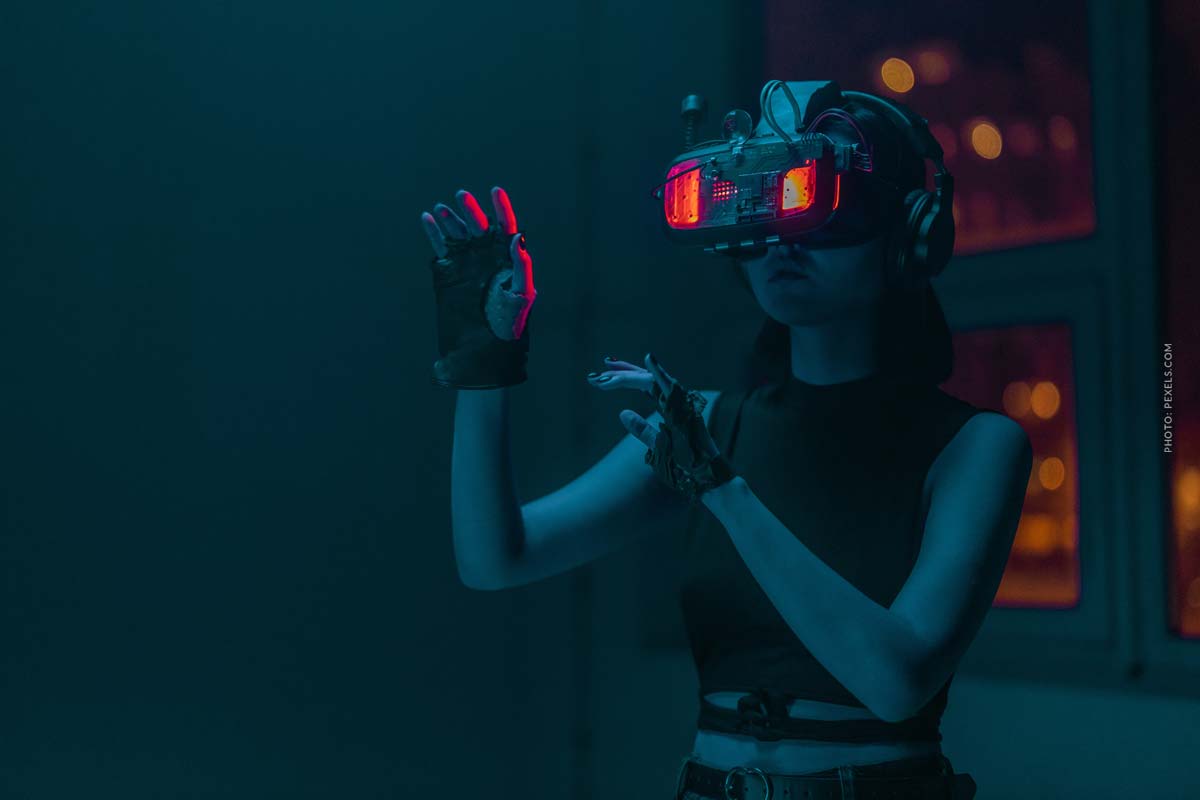 metaverse-vr-ar-glasses-virtual reality-woman-wearing-glasses-touches-something-virtually-black-outfit